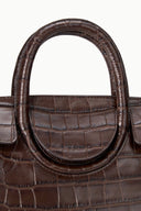 Mini carryall handbag with double rolled handles and croc-embossed front.