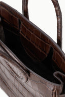Mini carryall handbag interior, croc-embossed brown with stitched pocket.