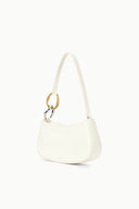 Off-white hobo handbag, angled view, curved silhouette with gold ring handle.