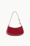 Wine red hobo bag with curved silhouette and adjustable shoulder strap