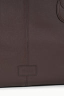 Espresso-brown tote bag back panel with stitched logo patch