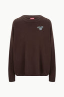 Dark chocolate cashmere crewneck sweater with small dog logo at chest