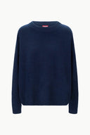 Navy cashmere relaxed crewneck sweater with long sleeves and ribbed cuffs