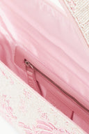 Beaded bag interior view with pink lining and zippered top closure