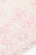Beaded fabric panel detail with pink cherry blossom toile pattern