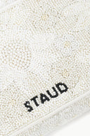 White beaded handbag with black 'STAUD' beaded logo and zipper trim.