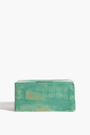 Teal glazed ceramic tissue box with square cutout slot on top