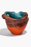 Red sunken vase bowl shape with turquoise inner glaze and dark brown textured rim