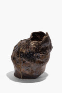 Small organic ceramic vase with dark brown textured glaze and curved open top