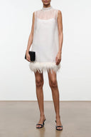 Ivory sleeveless mini dress with sheer yoke and feather trim hem