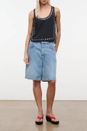 Black sleeveless top with studded neckline and front trim