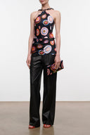 Black sleeveless silk top with colorful circular pattern and halter neckline
