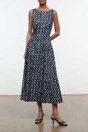 Sleeveless midi dress in navy with white teardrop pattern, round neck and fitted waist