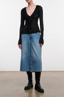 Black long-sleeve V-neck top with ruffle trim