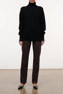 Black cashmere turtleneck sweater with long sleeves and a relaxed fit
