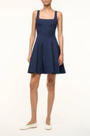 Navy sleeveless fit-and-flare dress with square neckline and pleated skirt