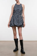 Sleeveless navy mini dress with all-over oval pattern and gathered waist