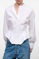 White button-front blouse with V-neck collar and long sleeves