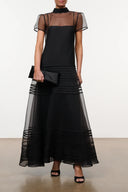 Black sheer-sleeve midi dress with high neck and tiered ruffle hem