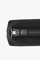 Black leather bag with gold-toned zipper pull and metal zipper slider