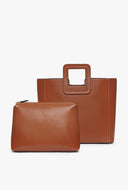 Tan leather bag with top handle and matching small zip pouch