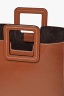 Tan leather bag interior lining with black pocket detail